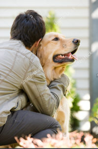 Teen guy with golden lab